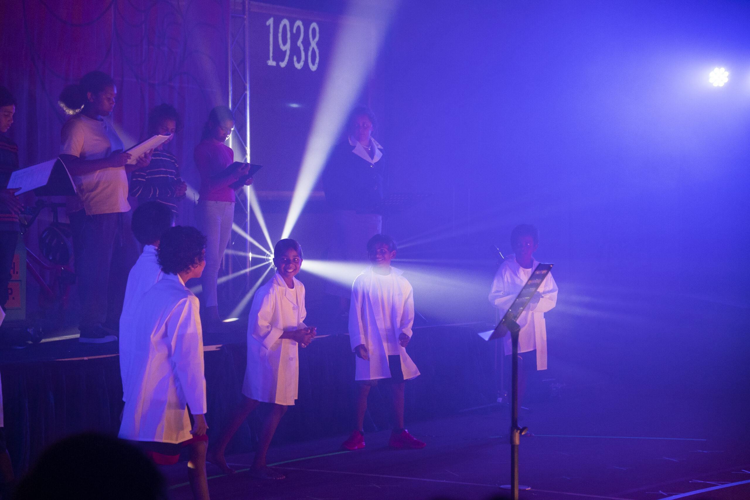 Students perform on stage